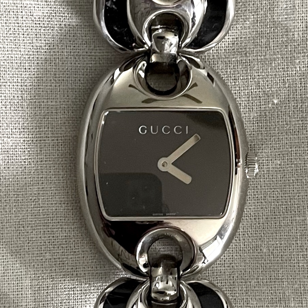 Gucci Mariner Black and Silver  Timepiece. Gucci Clasp on back.